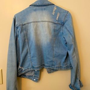 short jean jacket with rose patches . Very cute on.